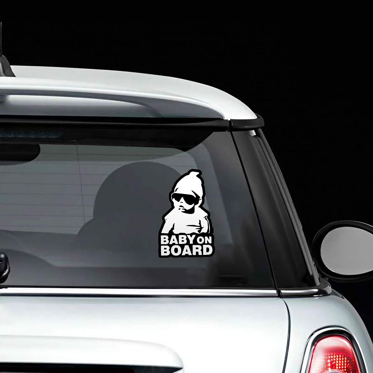 Baby on Board” sticker featuring a baby wearing glasses on a black background